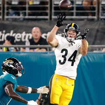 Aug 9, 2025; Jacksonville, Florida, USA; Pittsburgh Steelers running back Max Hurleman (34) catches a deep pass against the Jacksonville Jaguars during a preseason game at EverBank Stadium. Mandatory Credit: Travis Register-Imagn Images