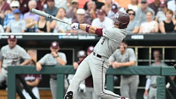 Jun 22, 2024; Omaha, NE, USA;  Texas A&M Aggies second baseman Kaeden Kent (3) drives in two runs with a single against the Tennessee Volunteers during the third inning at Charles Schwab Field Omaha. Mandatory Credit: Steven Branscombe-Imagn Images