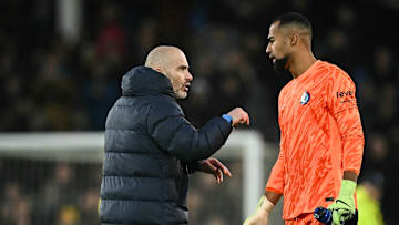 Chelsea goalkeeper Roberto Sanchez confers with coach Enzo Maresca