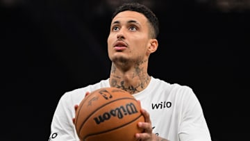 Apr 10, 2025; Milwaukee, Wisconsin, USA; Milwaukee Bucks forward Kyle Kuzma (18) warms up before game against the New Orleans Pelicans at Fiserv Forum. Mandatory Credit: Benny Sieu-Imagn Images