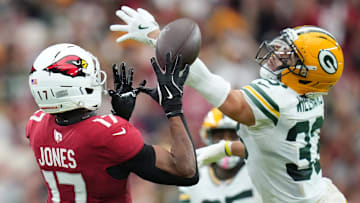 Arizona Cardinals receiver Zay Jones (17) catches a pass as Green Bay Packers safety Evan Williams (33) defends at State Farm Stadium in Glendale on Oct. 19, 2025.