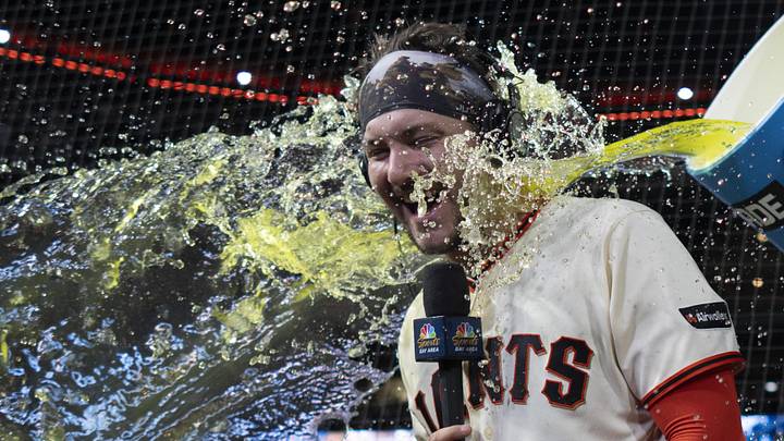 Apr 22, 2026: San Francisco Giants catcher Patrick Bailey (14) gets splashed after defeating the Los Angeles Dodgers at Oracle Park. 