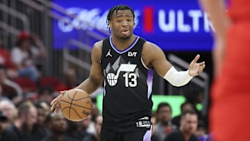 Apr 2, 2025; Houston, Texas, USA; Utah Jazz guard Isaiah Collier (13) dribbles the ball during the first quarter against the Houston Rockets at Toyota Center. Mandatory Credit: Troy Taormina-Imagn Images