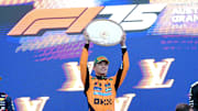 [US, Mexico & Canada customers only] March 16, 2025; Melbourne, AUSTRALIA; Lando Norris celebrates next to Max Verstappen and George Russell after winning the F1 Australian Grand Prix at Albert Park Grand Prix Circuit. Mandatory Credit: Tracey Nearmy/Reuters via Imagn Images