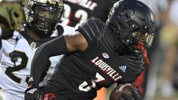 Oct 29, 2022; Louisville, Kentucky, USA;  Louisville Cardinals cornerback Quincy Riley (3) returns an interception against the Wake Forest Demon Deacons during the second half at Cardinal Stadium.