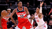 Nov 12, 2025; Houston, Texas, USA; Washington Wizards center Alex Sarr (20) handles the ball against Houston Rockets forward Jabari Smith Jr. (10) during the game at Toyota Center. Mandatory Credit: Erik Williams-Imagn Images