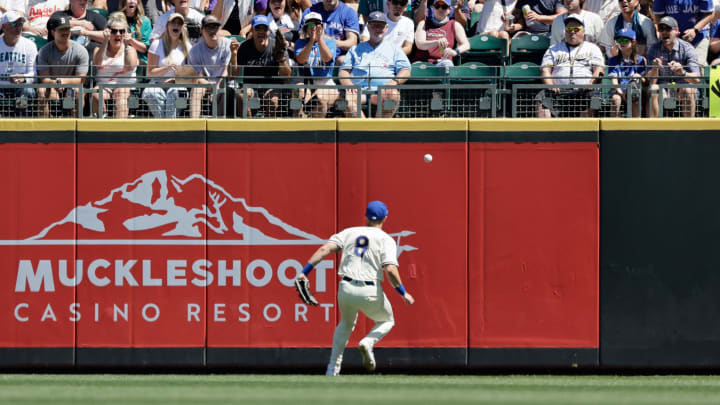 Seattle Mariners right fielder Dominic Canzone (8) watches the ball go over the fence for a ground rule double during the fourth inning hit by Toronto Blue Jays shortstop Bo Bichette (11) at T-Mobile Park. on July 7.