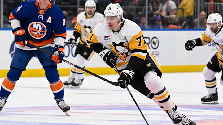 Apr 17, 2024; Elmont, New York, USA;  Pittsburgh Penguins center Evgeni Malkin (71) skates with the puck against the New York Islanders during the third period at UBS Arena. Mandatory Credit: Dennis Schneidler-Imagn Images