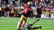 Nov 15, 2025; Chestnut Hill, Massachusetts, USA; Boston College Eagles wide receiver Reed Harris (4) eludes a tackle of a Georgia Tech Yellow Jackets defender during the second half at Alumni Stadium. Mandatory Credit: Bob DeChiara-Imagn Images