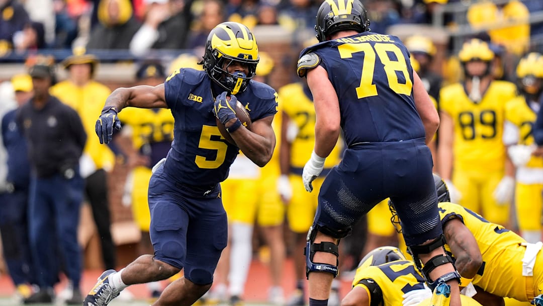 Team Blue running back Savion Hiter (5) runs against Team Maize during the spring game at Michigan Stadium in Ann Arbor on Saturday, April 18, 2026.