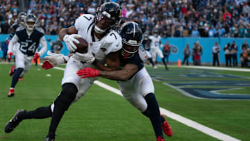 Jacksonville Jaguars wide receiver Zay Jones (7) is met by Tennessee Titans cornerback Sean