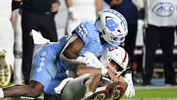 Nov 8, 2025; Chapel Hill, North Carolina, USA; North Carolina Tar Heels linebacker Tyler Thompson (40) sacks Stanford Cardinal quarterback Elijah Brown (2) in the fourth quarter at Kenan Stadium. 