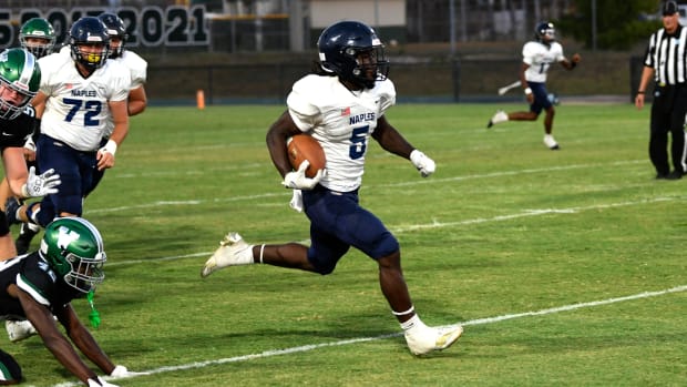 Naples Golden Eagles running back Shawn Simeon (#5) is hard to stop. Spring football was back as Venice hosted the Naples