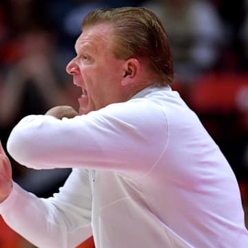 Nov 4, 2024; Champaign, Illinois, USA;  Illinois Fighting Illini head coach Brad Underwood reacts during the first half against the Eastern Illinois Panthers at State Farm Center. Mandatory Credit: Ron Johnson-Imagn Images