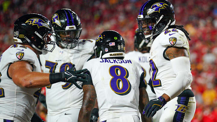 Baltimore Ravens running back Derrick Henry (22) celebrates with quarterback Lamar Jackson (8) after scoring against the Kansas City Chiefs during the first half at GEHA Field at Arrowhead Stadium.