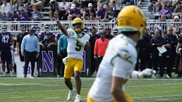 Sep 13, 2025; Evanston, Illinois, USA; Oregon Ducks quarterback Dante Moore (5) throws the ball against the Northwestern Wildcats during the second half at Northwestern Medicine Field at Martin Stadium. Mandatory Credit: David Banks-Imagn Images