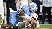 Nov 8, 2025; Chapel Hill, North Carolina, USA; North Carolina Tar Heels linebacker Tyler Thompson (40) sacks Stanford Cardinal quarterback Elijah Brown (2) in the fourth quarter at Kenan Stadium. Mandatory Credit: Bob Donnan-Imagn Images
