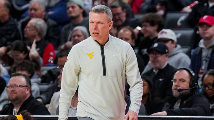 Feb 5, 2026; Cincinnati, Ohio, USA;  West Virginia Mountaineers head coach Ross Hodge works the sideline against the Cincinnati Bearcats in the first half at Fifth Third Arena. Mandatory Credit: Aaron Doster-Imagn Images