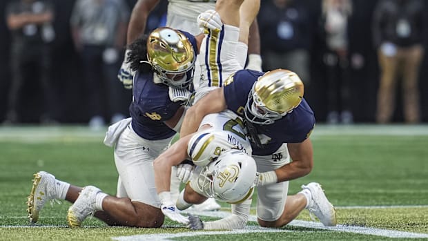 Notre Dame linebackers tackle a Georgia Tech player on Saturday 