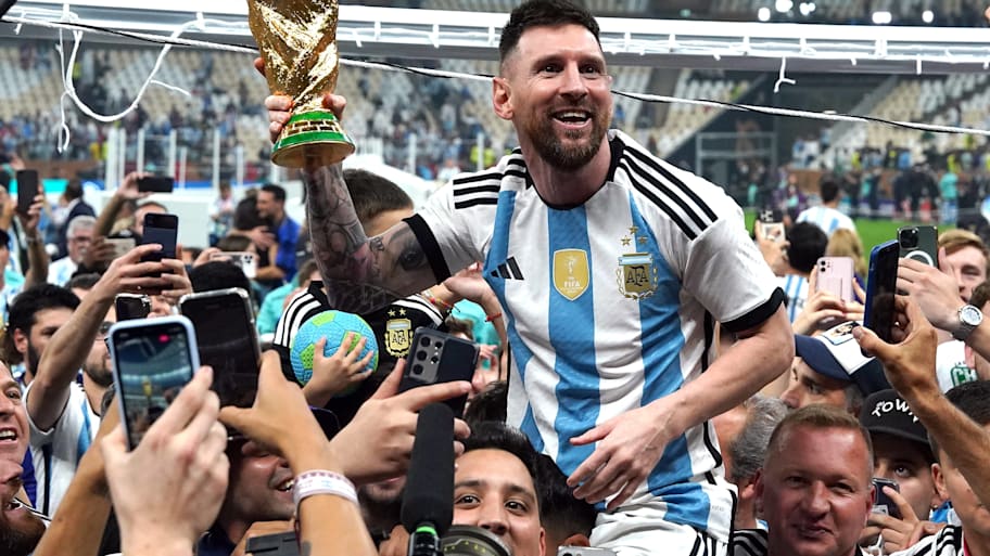 Lionel Messi lifts the World Cup.