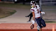 Jenks’ Kaydin Jones (2) runs the ball for a touchdown during a high school football game between Mustang and Jenks in Mustang, Okla., on Friday, Oct. 11, 2024.