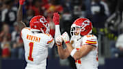 Nov 27, 2025; Arlington, Texas, USA; Kansas City Chiefs wide receiver Xavier Worthy (1) and Kansas City Chiefs tight end Travis Kelce (87) celebrate after a touchdown against the Dallas Cowboys during the first quarter at AT&T Stadium. Mandatory Credit: Kevin Jairaj-Imagn Images