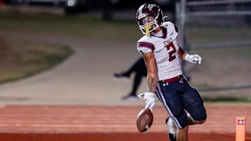 Jenks’ Kaydin Jones (2) runs the ball for a touchdown during a high school football game between Mustang and Jenks in Mustang, Okla., on Friday, Oct. 11, 2024.