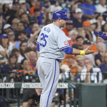 Kansas City Royals shortstop Bobby Witt Jr. (7) celebrates with third base coach Vance Wilson (25) after hitting a home run during the seventh inning against the Houston Astros at Minute Maid Park on Sept. 1.