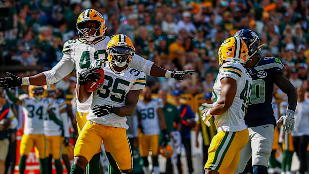 Green Bay Packers linebacker Jamon Johnson (48) and cornerback Corey Ballentine (35) celebrate.