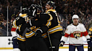 Mar 11, 2025; Boston, Massachusetts, USA; Boston Bruins defenseman Nikita Zadorov (91) joins the celebration after center Pavel Zacha (18) scored the go ahead goal as Florida Panthers center Evan Rodrigues (17) looks away during the third period at TD Garden. Mandatory Credit: Winslow Townson-Imagn Images