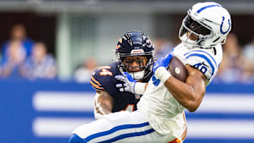 Aug 19, 2023; Indianapolis, Indiana, USA; Indianapolis Colts tight end Pharaoh Brown (49) is tackled by Chicago Bears linebacker Noah Sewell (44) in the first quarter at Lucas Oil Stadium. Mandatory Credit: Trevor Ruszkowski-Imagn Images
