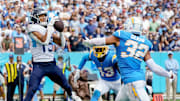 Tennessee Titans wide receiver Nick Westbrook-Ikhine (15) brings in a touchdown past Los Angeles Chargers cornerback Michael Davis (43) and safety Alohi Gilman (32) in 2023.