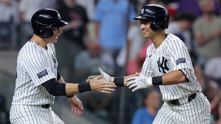 Aug 2, 2024; Bronx, New York, USA; New York Yankees shortstop Anthony Volpe (11) celebrates his two run home run against the Toronto Blue Jays with first baseman Ben Rice (93) during the fifth inning at Yankee Stadium. Mandatory Credit: Brad Penner-USA TODAY Sports