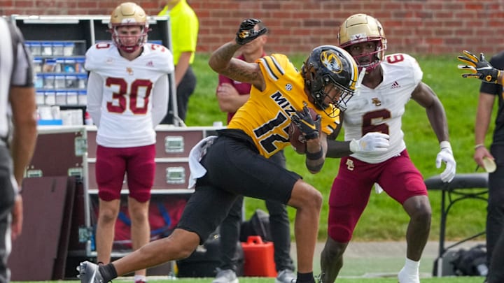 Sep 14, 2024; Columbia, Missouri, USA; Missouri Tigers cornerback Dreyden Norwood (12) intercepts a pass intended for Boston College Eagles wide receiver Jaedn Skeete (6) during the second half at Faurot Field at Memorial Stadium. Mandatory Credit: Denny Medley-Imagn Images