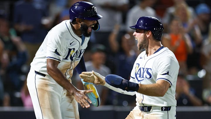 Tampa Bay Rays third baseman Junior Caminero (13) and outfielder Josh Lowe (15) react after scoring runs against the Baltimore Orioles in the seventh inning at George M. Steinbrenner Field. Tampa Bay Rays third baseman Junior Caminero (13) and outfielder Josh Lowe (15) react after scoring runs against the Baltimore Orioles in the seventh inning at George M. Steinbrenner Field.