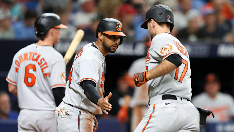 Jul 20, 2023; St. Petersburg, Florida, USA;  Baltimore Orioles center fielder Aaron Hicks (34) and Colton Cowser high five