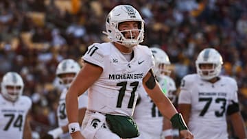 Nov 1, 2025; Minneapolis, Minnesota, USA; Michigan State Spartans quarterback Alessio Milivojevic (11) celebrates a touchdown against the Minnesota Golden Gophers during the second half at Huntington Bank Stadium. Mandatory Credit: Matt Krohn-Imagn Images