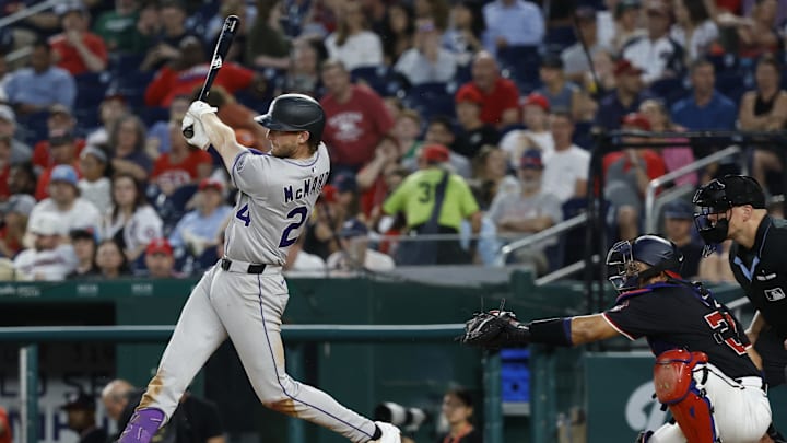 Jun 17, 2025; Washington, District of Columbia, USA; Colorado Rockies third baseman Ryan McMahon (24) hits a solo home run against the Washington Nationals during the seventh inning at Nationals Park. 