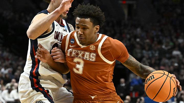 Mar 21, 2026; Portland, OR, USA; Texas Longhorns forward Dailyn Swain (3) drives against Gonzaga Bulldogs guard Jalen Warley (8) in the first half during a second round game of the men's 2026 NCAA Tournament at Moda Center. Mandatory Credit: Craig Strobeck-Imagn Images