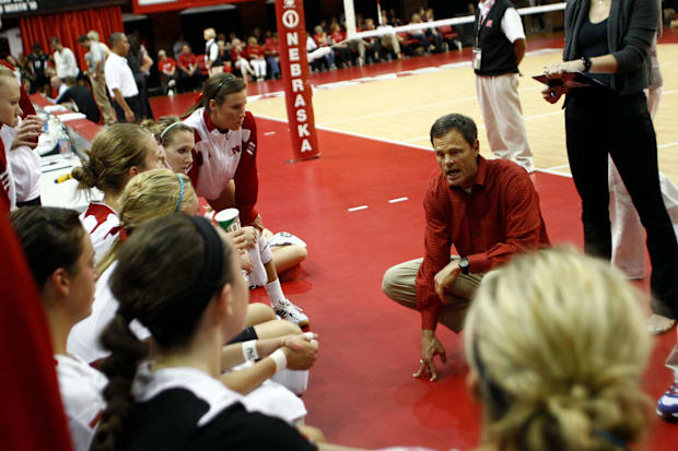 Nebraska Cornhuskers head coach John Cook talks to his players in the fourth set against the Purdue Boilermakers.