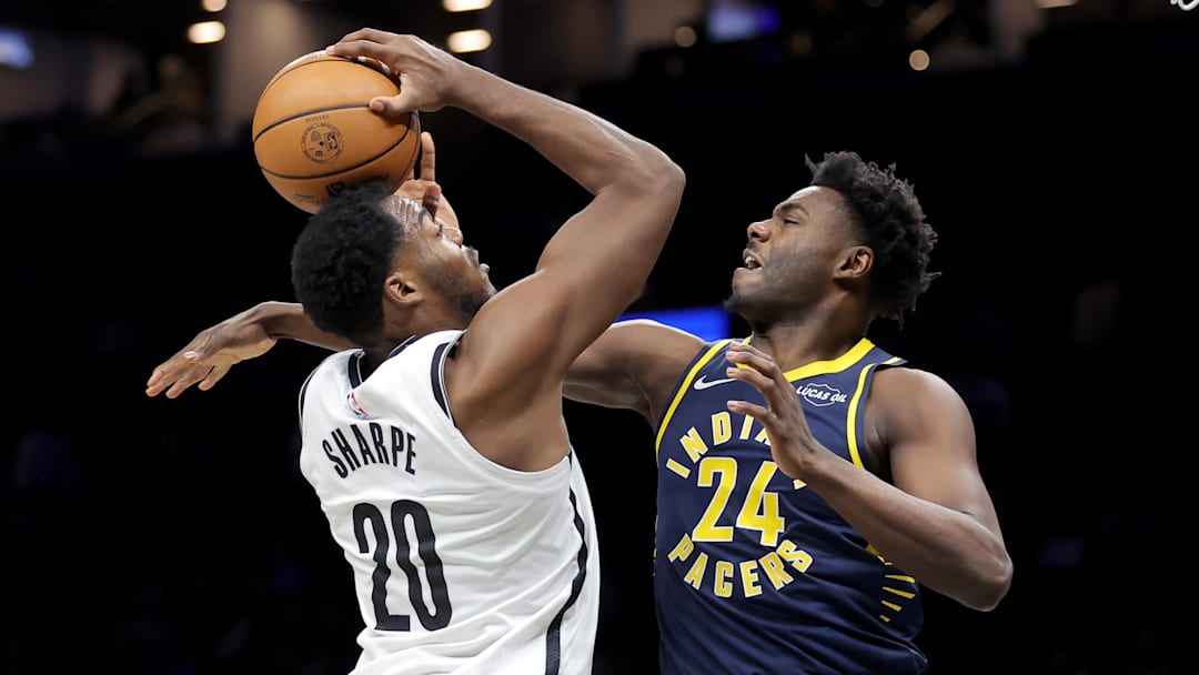 Feb 11, 2026; Brooklyn, New York, USA; Brooklyn Nets center Day'ron Sharpe (20) is fouled by Indiana Pacers guard Kobe Brown (24) as he drives to the basket during the first quarter at Barclays Center. Mandatory Credit: Brad Penner-Imagn Images