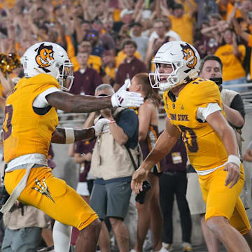 Arizona State quarterback Sam Leavitt (10) celebrates his touchdown run with teammate Jordyn Tyson (0) Jordyn Tyson against the Mississippi State Bulldogs at Mountain America Stadium in Tempe on Sept. 7, 2024.