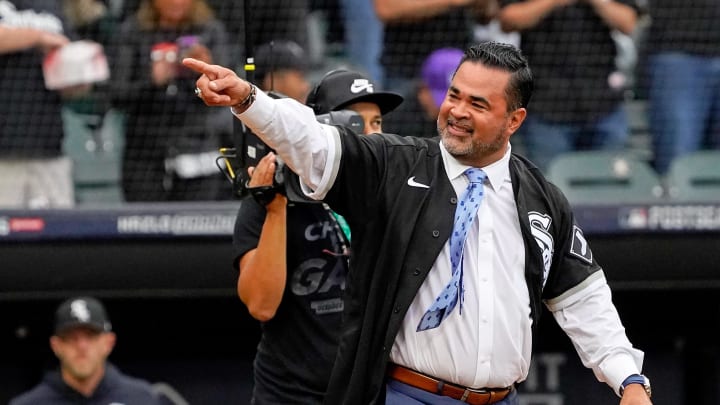 Former Chicago White Sox player and manager Ozzie Guillen acknowledges the crowd as he walks onto the field before throwing a ceremonial first pitch before game four of the 2021 ALDS between the Chicago White Sox and the Houston Astros at Guaranteed Rate Field in 2021.