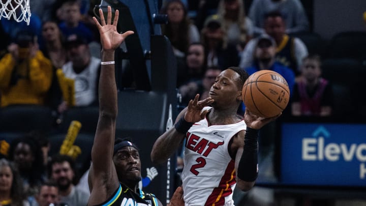 Apr 7, 2024; Indianapolis, Indiana, USA; Miami Heat guard Terry Rozier (2) passes the ball while Indiana Pacers forward Pascal Siakam (43) defends in the first half at Gainbridge Fieldhouse. Mandatory Credit: Trevor Ruszkowski-USA TODAY Sports