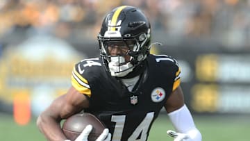 Nov 17, 2024; Pittsburgh, Pennsylvania, USA;  Pittsburgh Steelers wide receiver George Pickens (14) runs after a  catch against the Baltimore Ravens during the first quarter at Acrisure Stadium. Mandatory Credit: Charles LeClaire-Imagn Images