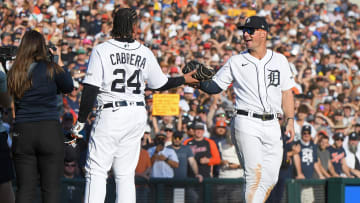 Detroit Tigers'Miguel Cabrera "passes the torch" of his fielding glove to Spencer Torkelson in Cabrera's final MLB game.