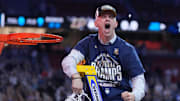 Apr 8, 2024; Glendale, AZ, USA;  Connecticut Huskies head coach Dan Hurley celebrates after cutting down the net after defeating the Purdue Boilermakers in the national championship game of the Final Four of the 2024 NCAA Tournament at State Farm Stadium. Mandatory Credit: Robert Deutsch-Imagn Images