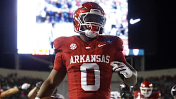 Dec 27, 2024; Memphis, TN, USA; Arkansas Razorbacks running back Braylen Russell (0) reacts after a touchdown during the first quarter against the Texas Tech Red Raiders at Simmons Bank Liberty Stadium. Mandatory Credit: Petre Thomas-Imagn Images