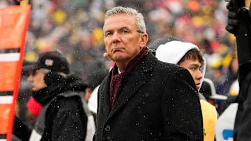 Former head coach Urban Meyer watches from the sideline during the NCAA football game between the Michigan Wolverines and the Ohio State Buckeyes at Michigan Stadium in Ann Arbor, Mich. on Nov. 29, 2025. Ohio State won 27-9.