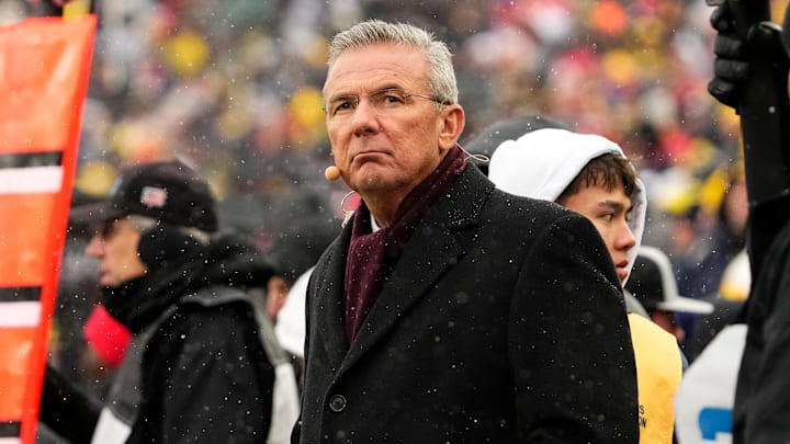 Former head coach Urban Meyer watches from the sideline during the NCAA football game between the Michigan Wolverines and the Ohio State Buckeyes at Michigan Stadium in Ann Arbor, Mich. on Nov. 29, 2025. Ohio State won 27-9.